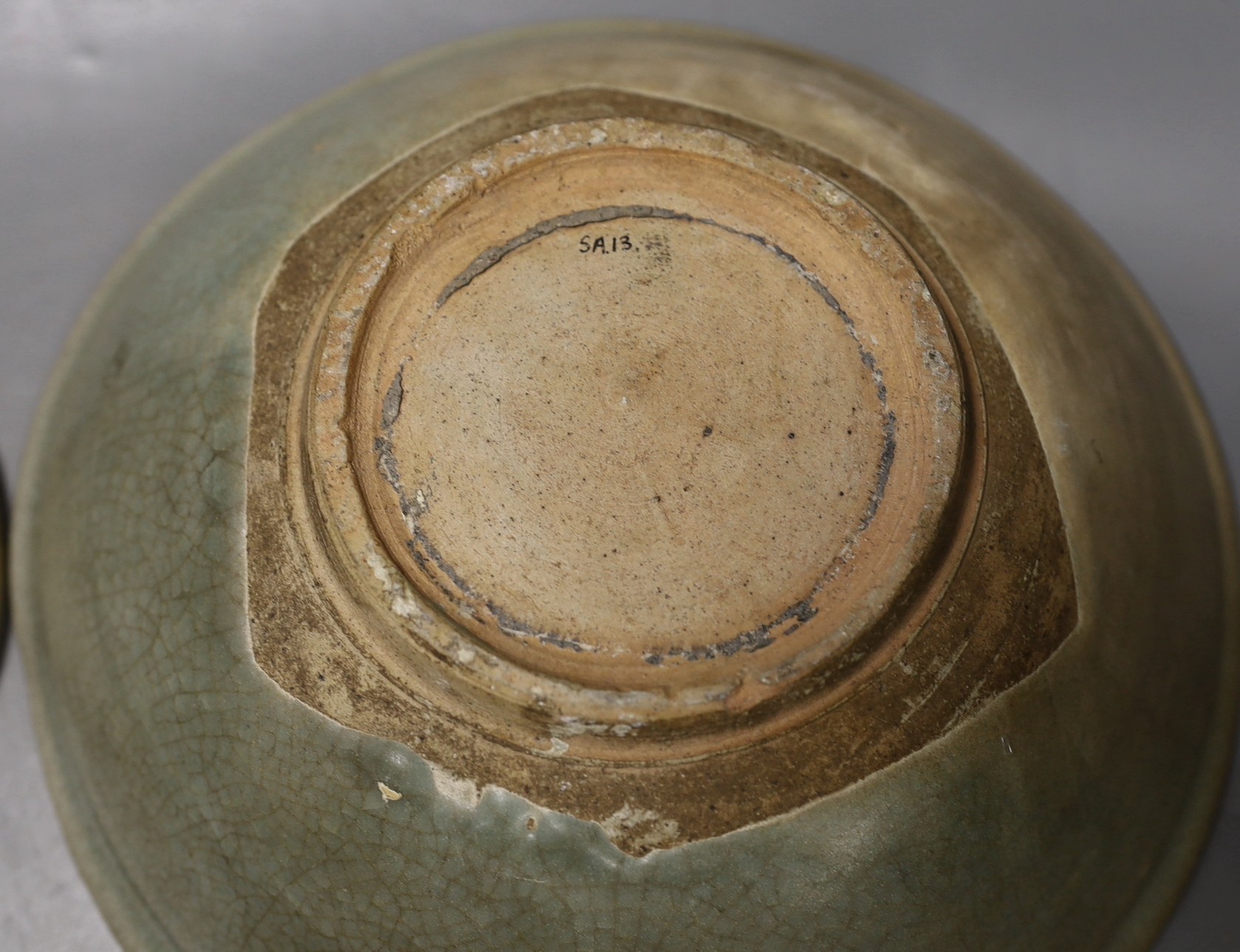 A Chinese celadon dish, probably Southern Song Dynasty, 17.5cm and a Thai Sawankhalok celadon deep dish, 16th century, largest 27cm